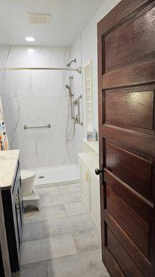 Looking from the door to the new accessible shower.