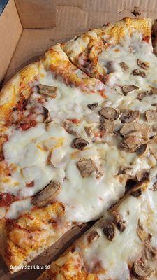 Half cheese pizza and half mushroom & onion. Very skimp on the toppings! Not good crust ... very little sauce. It wasn't hot when arrived.