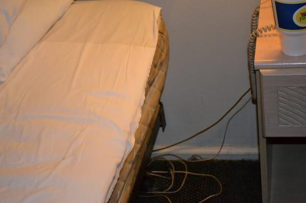 Sheets didn't cover the whole bed and notice how dirty it was on the baseboards.