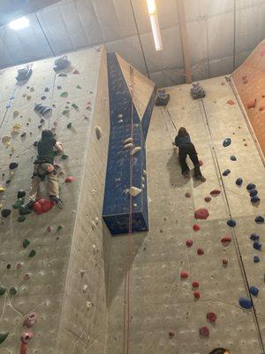 Auto belay. Where you climb if you're not checked off to assist (good thing! ) variety of skill levels offered for climbing even over here.
