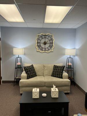 Comfortable couch for patients to sit on.