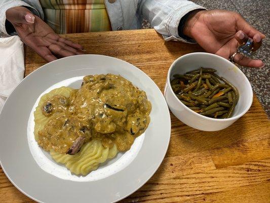 Smothered Pork Chop mashed potatoes and green beans