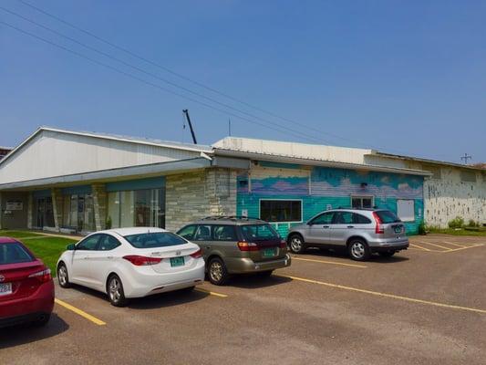 Office building containing team management offices and retail store.