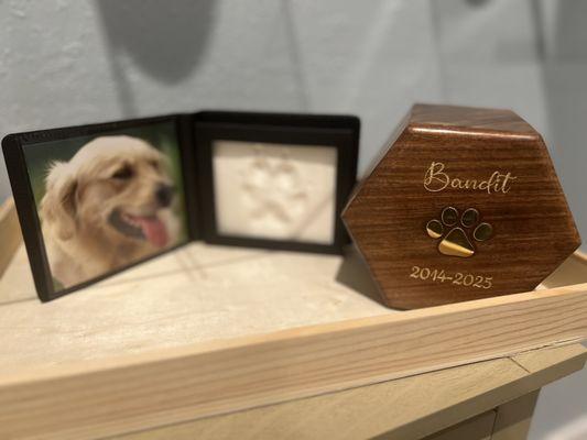Plaster paw print and engraved wood urn