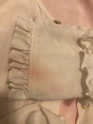 It looks like someone poured Red ink on my top. Then tried to get it out.