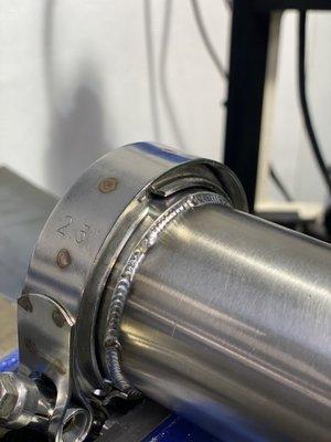 TIG welding on a stainless steel v-band for a custom exhaust