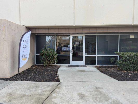 Rise Pole Fitness has a flag out front of their studio.