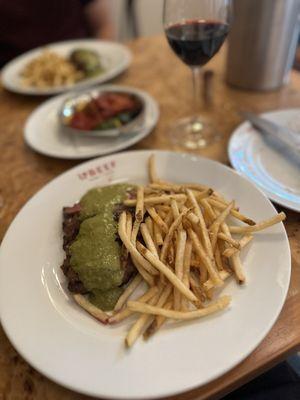 Steak and frites with delicious green le beef sauce