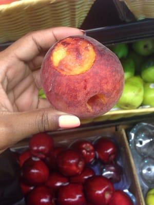 A bitten ?? peach at $1.99 a pound. Should be cheaper to buy bitten fruit that was burrowed through by some creature O_o
