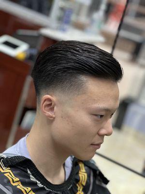 Low skin fade with full top. Elevate and feel great!