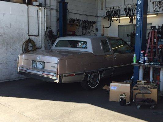 My rare '91 Fleetwood coupe in the service bay.