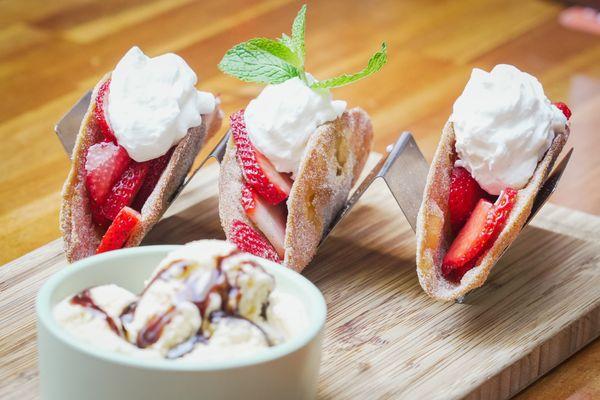 BUÑUELO TACOS crispy buñuelo shells, fresh strawberries, whipped cream, vanilla ice cream