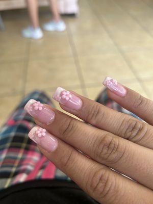 Pink french tip with flowers.