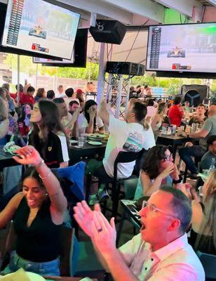 F1 fans cheering every lap at Miami's top race-day watch bar.