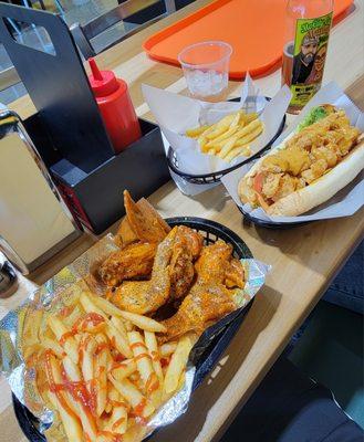 Hot Lemon Pepper Steppas & Shrimp Poboy with Three Kings Punch and a Muddy Water