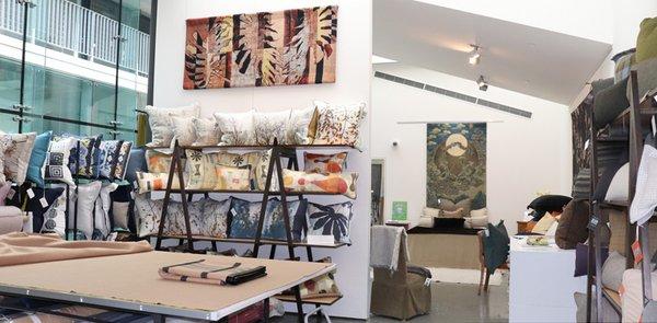 Showroom workspace and decorative pillow display