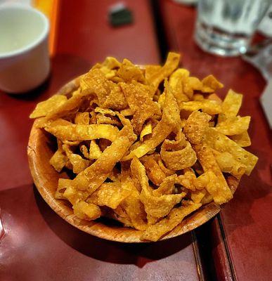 Fried noodles for soup. You can make them by slicing wonton wrappers into strips and deep-frying them. A fast but pricey method.