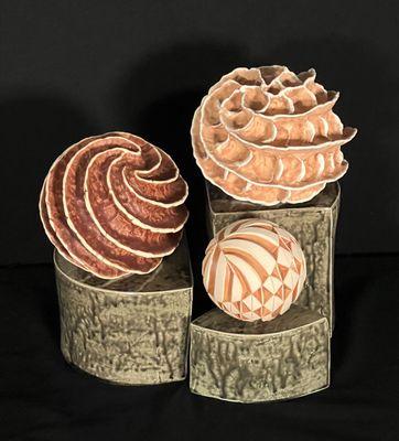 A grouping of altered clay spheres. Hand made, unique ceramic art.