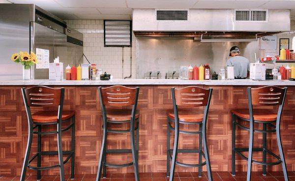 Bar area to either sit and wait for the food or dine-in