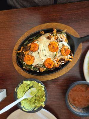 Steak chicken and shrimp fajitas