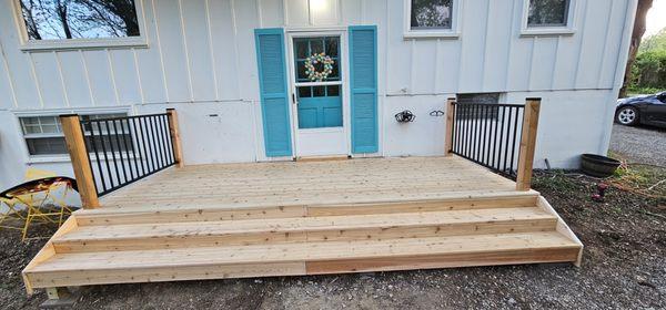 Cedar deck and posts with black aluminum railing