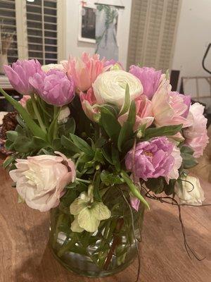 What the arrangement looks like in person complete with wilting flowers