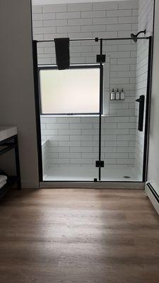 Shower with huge window.