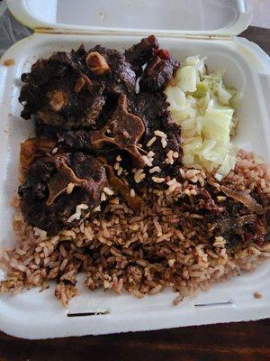 Oxtails cabbage and peas & rice