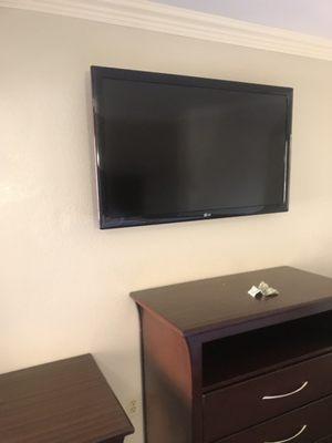 Flat screen on the wall., definitely a plus