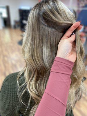 This guest is wearing 1 row of 18" hair extensions to add volume to her natural hair length.