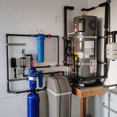 Hybrid heat pump water heater, multi stage water filtration with UV and water softener.