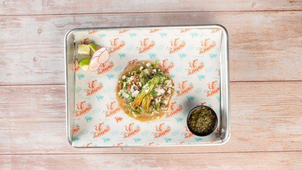 Flor de Calabaza Taco: Roasted squash blossom, sweet camote, mezcal, caramelized onion, pepita pesto, and Mexican oregano blend.