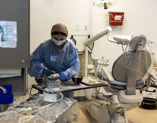 Dental Assisting Students in class learning how to make retainers.