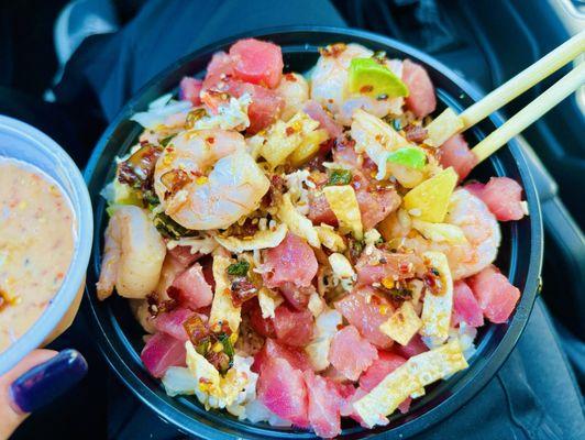 Ahi Poke bowl added Shrimp, scoop of crab, avocado, pineapple, wontons and their spicy Hawaiian sauce with a spicy aioli on the side