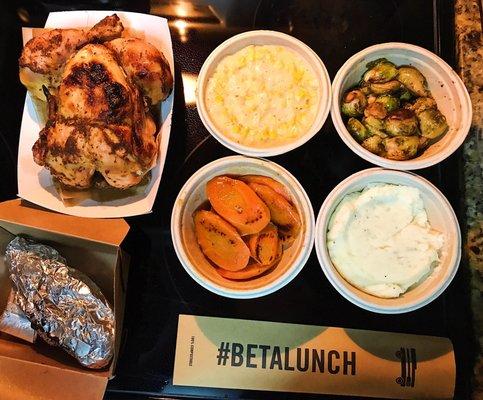 Whole Cajun Chicken, creamed corn, Brussel sprouts, mashed potatoes, carrots, and a sweet potato.