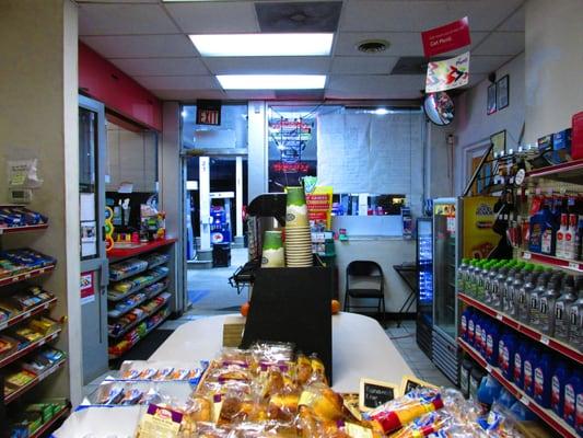 inside the convenience store with ATM, coffee and sugary and fatty snacks, some peanuts, and some baked goods