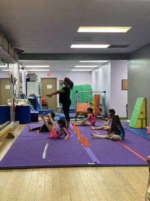 Ms. Lida teaching the kids during warm ups