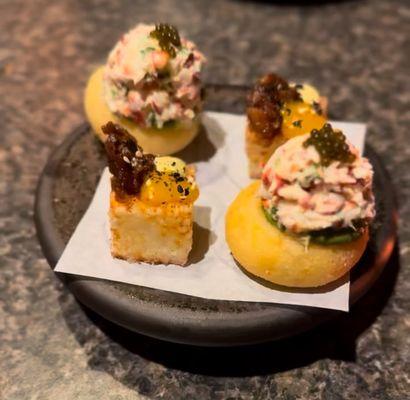 Arepa with lobster and a polenta cube with yolk