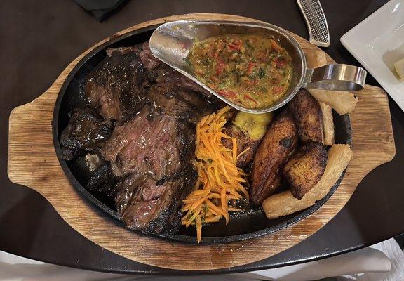 Lamb chop was an apple mint sauce with chopped carrots, sliced baked potatoes. Very tasty!