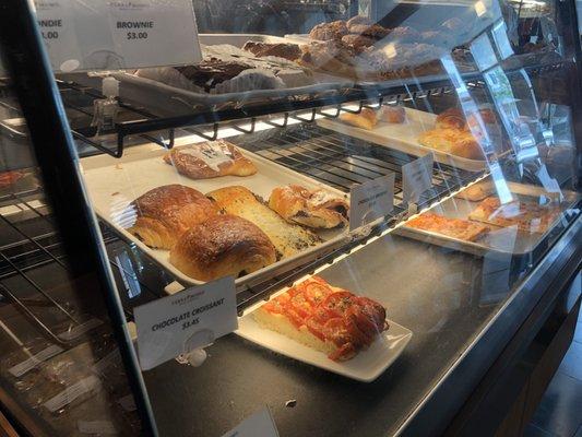 Fresh baked croissants (with flavors), other pastries such as brownies above, and a loaf of focaccia bread below. (6/24/2018)
