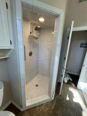 Shower update! Emser 12x24 tile style Visconde color Oro with 2x2 hex mosaic floor.