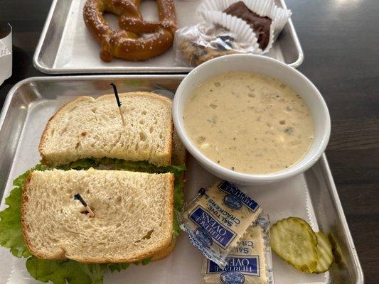 Chicken salad sandwich on sour dough with chicken chili soup and my pretzel in the background