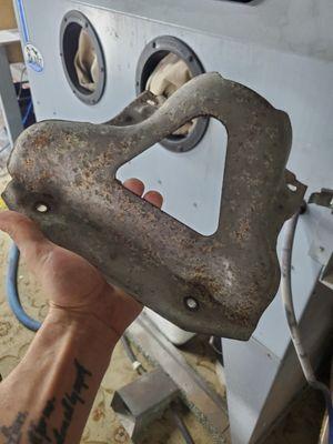 Rusty heat shield in for some sand blasting and powder coating