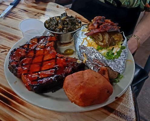 Bourbon-glazed, thick-cut Pork Chop, vinegar Collards, bread and a 2lb loaded Baked Potato (as a SIDE!!!). All for just - $14.99!!!!