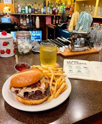 Breakfast burger with bacon, egg, and hashbrown and side of crispy fries
