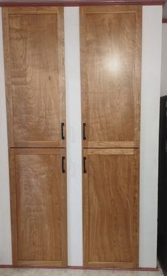 The new red birch cabinet doors the Forbes Co. created with the pull handles we selected.