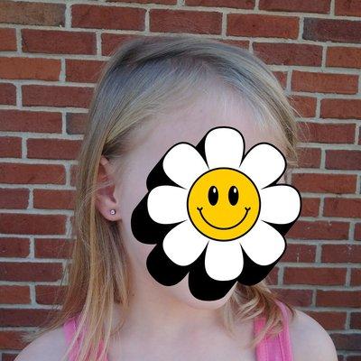 My 7 year old daughter so excited about her new piercings, thank you, John!