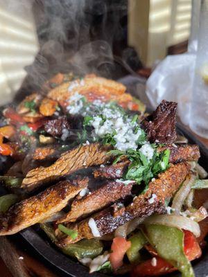 Half beef/half chicken fajitas.