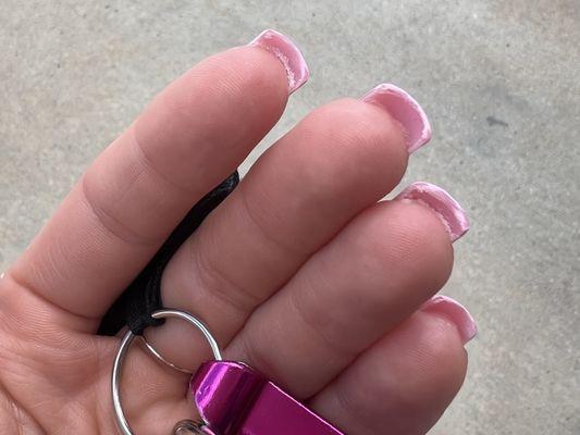 Glue under the nails, messy paint job on the tips.