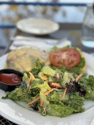 cheeseburger with salad.